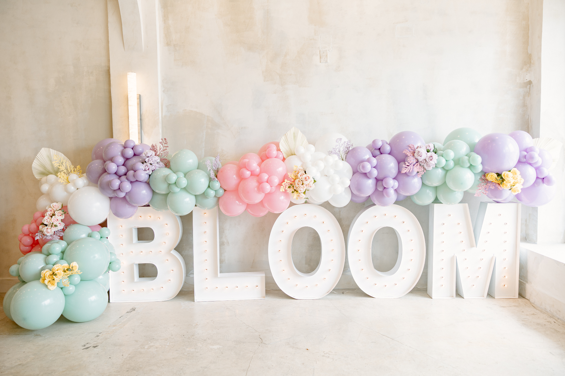 Bloom marquee letters with pastel balloon garland